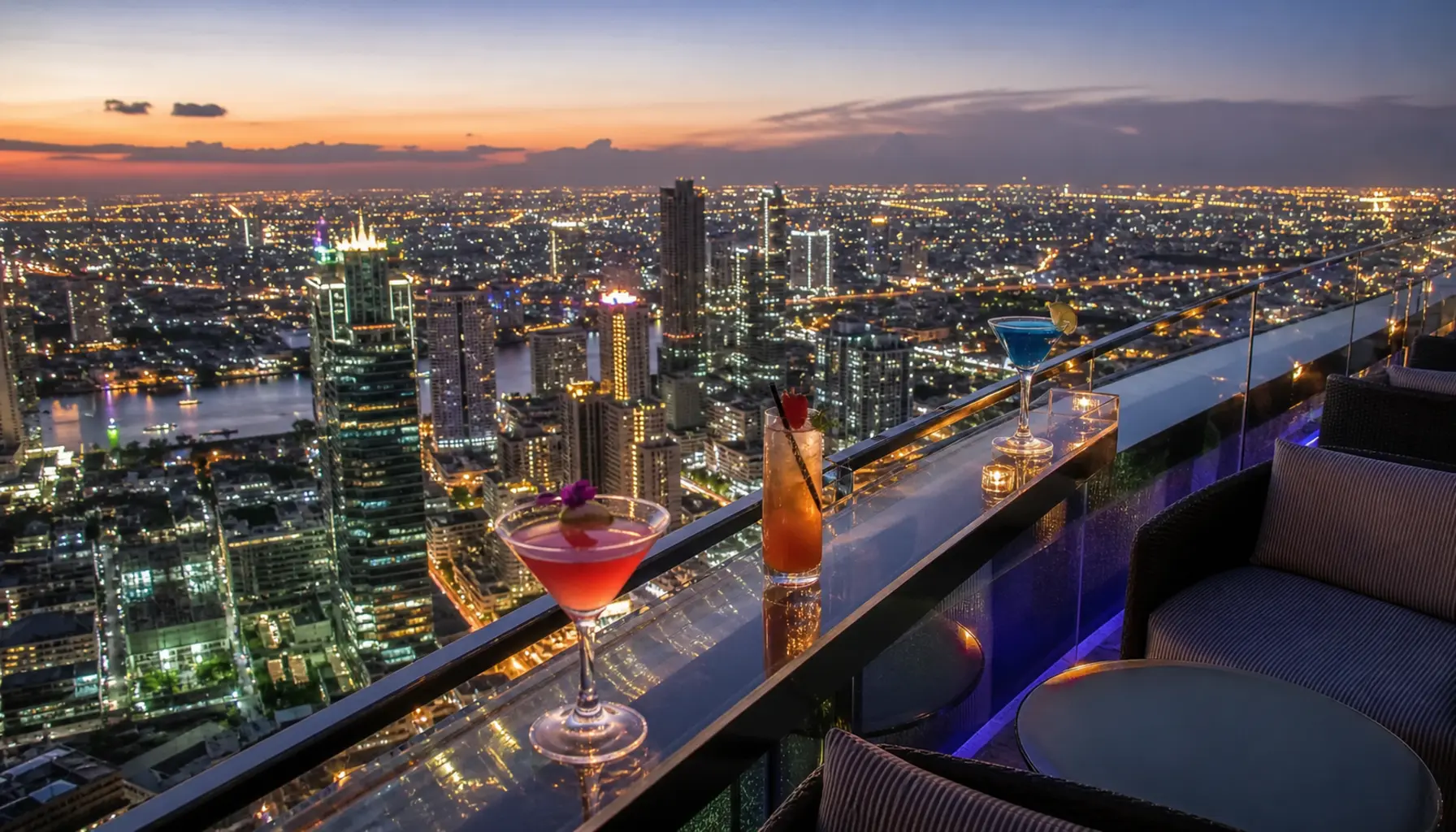 A Bangkok rooftop bar with the skyline glittering below