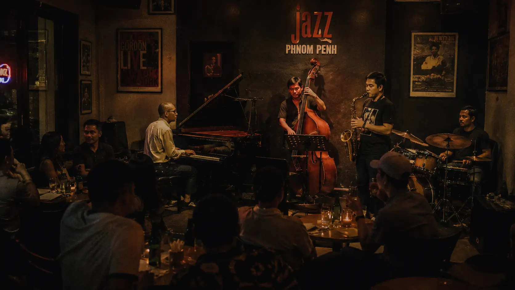 Phnom Penh jazz bar with a small live band on a low stage, brass section in silhouette and a candle-lit audience leaning in