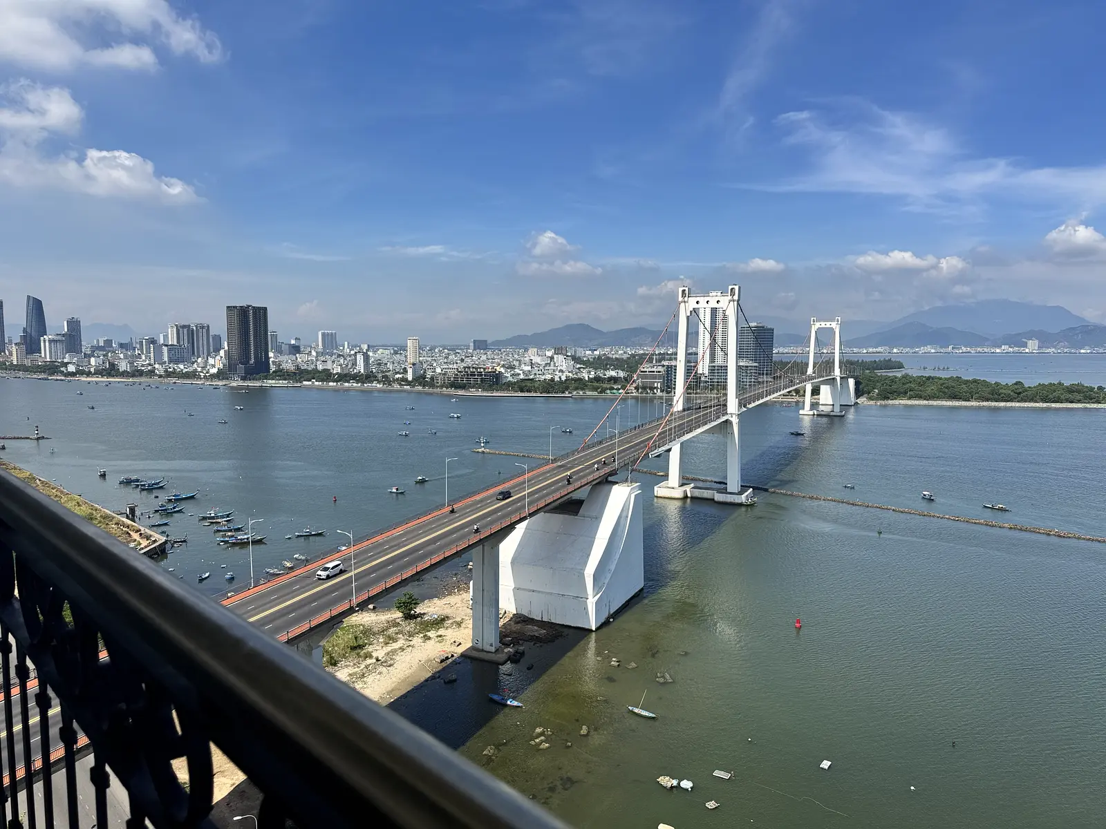 Daytime view over Thuan Phuoc Bridge and the Da Nang skyline from a Golden Bay balcony